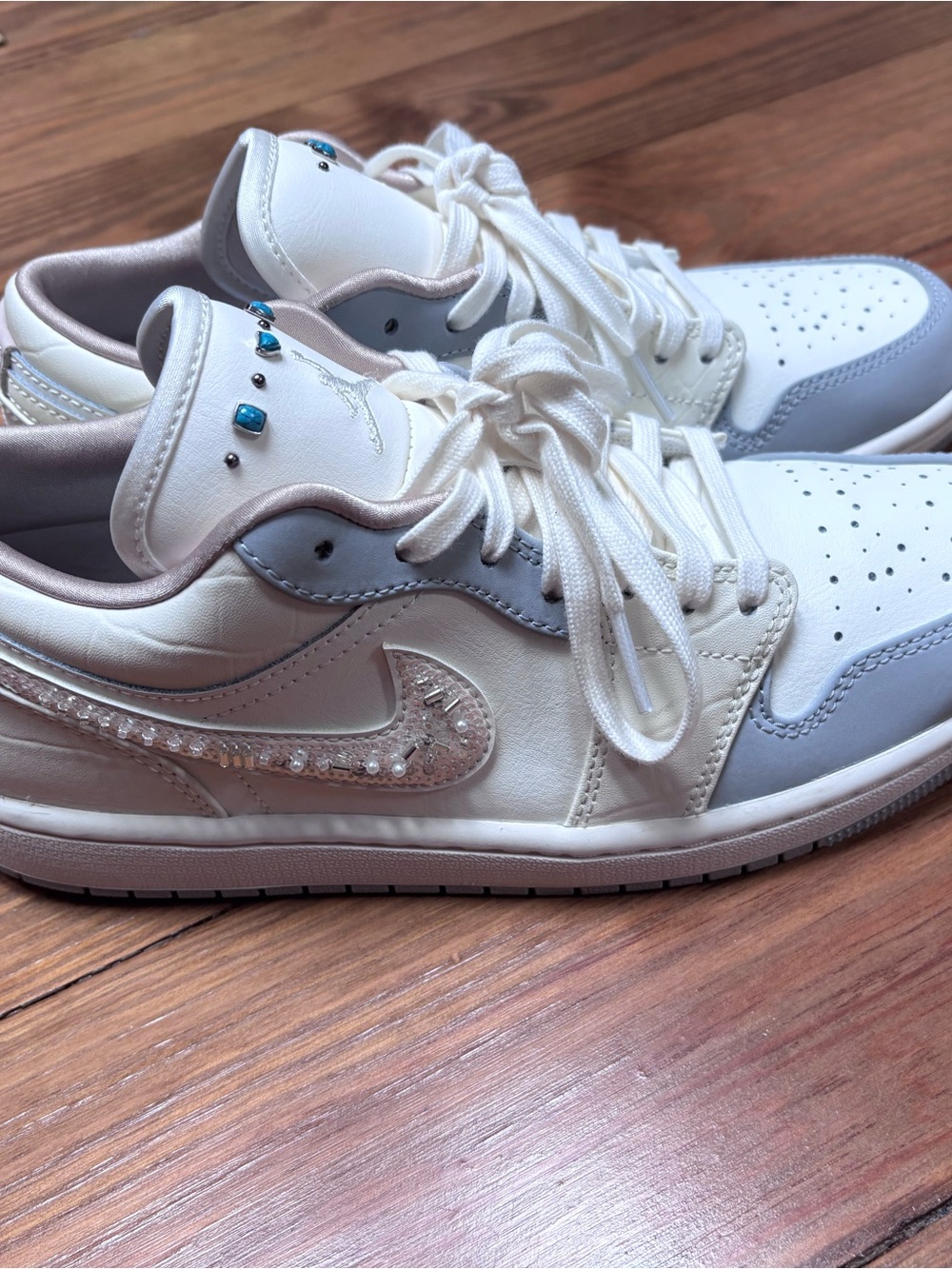 Nike Women’s Low-Top Air Jordan Sneakers in White / Gray with Crystal Swoosh
